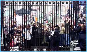 Pupils block 10 Downing Street gates in an anti-war march